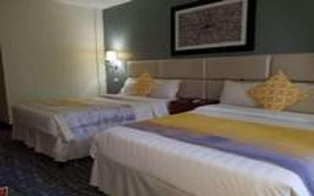 Century Hotel Garapan Quarto foto